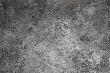 Retro taş beton, koyu gri arka plan, eski sürtünmeler ve siyah lekeler. İğrenç boyanmış döşeme ya da grunge tarzında duvar çimento dokusu. Metin için boşluk