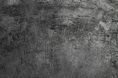 Retro taş beton, koyu gri arka plan, eski sürtünmeler ve siyah lekeler. İğrenç boyanmış döşeme ya da grunge tarzında duvar çimento dokusu. Metin için boşluk