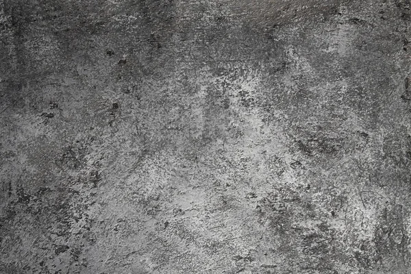 Retro taş beton, koyu gri arka plan, eski sürtünmeler ve siyah lekeler. İğrenç boyanmış döşeme ya da grunge tarzında duvar çimento dokusu. Metin için boşluk