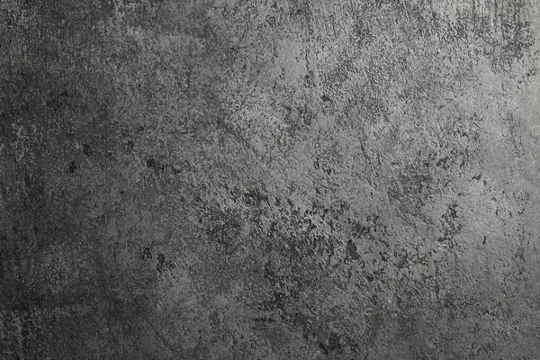 retro stone Concrete dark gray background with old absolete scuffs and black splashes. Grungy paint Textured floor or wall cement texture in the grunge style. Space for text