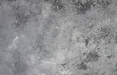 Retro taş beton, koyu gri arka plan, eski sürtünmeler ve siyah lekeler. İğrenç boyanmış döşeme ya da grunge tarzında duvar çimento dokusu. Metin için boşluk
