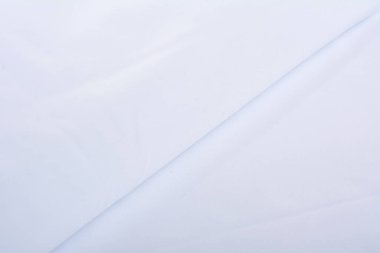 Beyaz örülmüş elastik kumaş, ipliklerin dokuması, buruşuk katlama. İç çamaşırı, spor kıyafetler ve mayo için. Metin için boşluk.