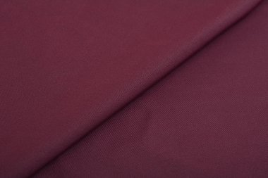 mor örülmüş elastik kumaş, ipliklerin dokuması, buruşuk katlama. İç çamaşırı, spor kıyafetler ve mayo için. Metin için boşluk.
