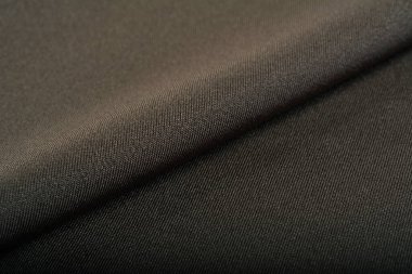 haki örülmüş elastik kumaş, ipliklerin dokuması, buruşuk katlama. İç çamaşırı, spor kıyafetler ve mayo için. Metin için boşluk.