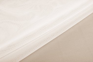 bej örülmüş elastik kumaş, ipliklerin dokuması, buruşuk katlama. İç çamaşırı, spor kıyafetler ve mayo için. Metin için boşluk.