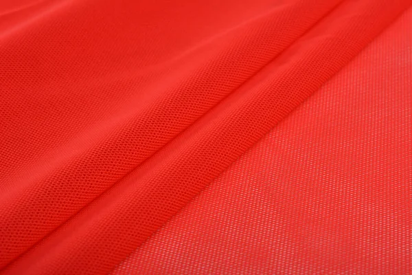 赤編み弾性生地 糸の質感の織り 折り目の折り目 スポーツ服や水着のために テキストのスペース — ストック写真