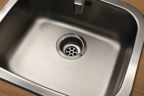 Close-up of a drain in a steel sink. Clean sink, no blockages. Water supply. — Stock Image Close Drain Steel Sink Clean Sink Blockages Water Supply Royalty Free Stock Images