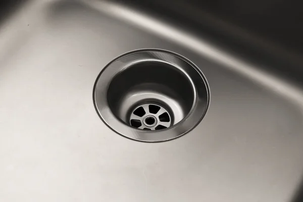 Close-up of a drain in a steel sink. Clean sink, no blockages. Water supply. — Stock Image Close Drain Steel Sink Clean Sink Blockages Water Supply Stock Image
