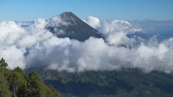 View of dormant volcano Agua in the clouds from volcano Acatenango, Guatemala, Central America.