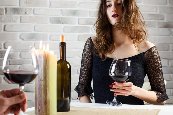 Young woman making an exasperated expression gesture on a bad date at the restaurant