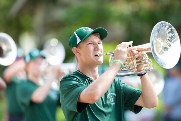 Arlington, Texas, USA - July 4, 2019: Arlington 4th of July Parade, Members of Arlington High School, marching band, performing at the parade