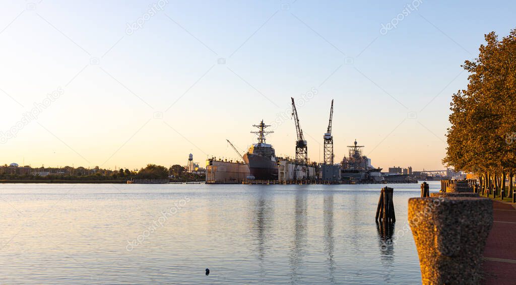 View of Elizabeth River with dry docks and warships of the US Navy in Norfolk