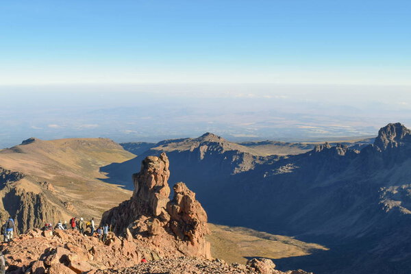 A group of hikers in the scenic mountain landscapes of Mount Kenya