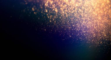 Altın ışıltı stardust koyu arka plan üzerinde