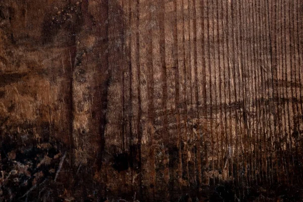 Wood texture, Dark Brown scratched wooden cutting board. Natural Dark Background.