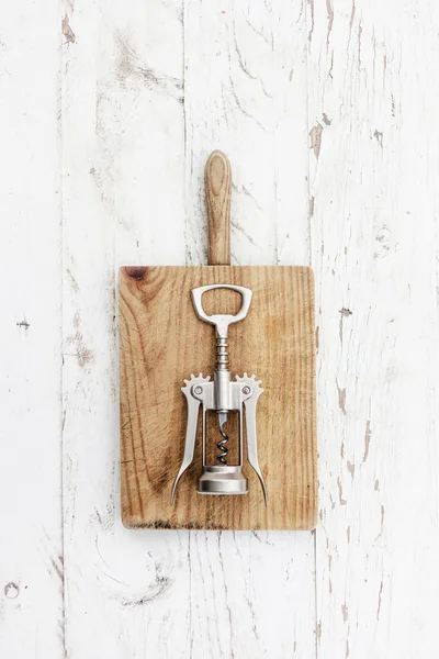 Steel Corkscrew Wooden Chopping Board White Wooden Background — Stock Photo, Image