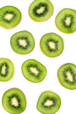 Creative layout made of Kiwi fruits isolated on white background clipart