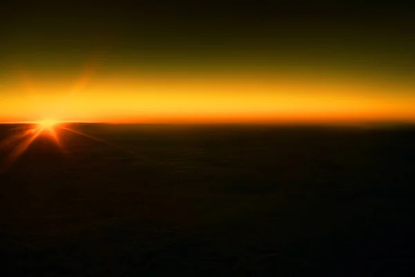 View from airplane window on wing over clouds. Travel concept.