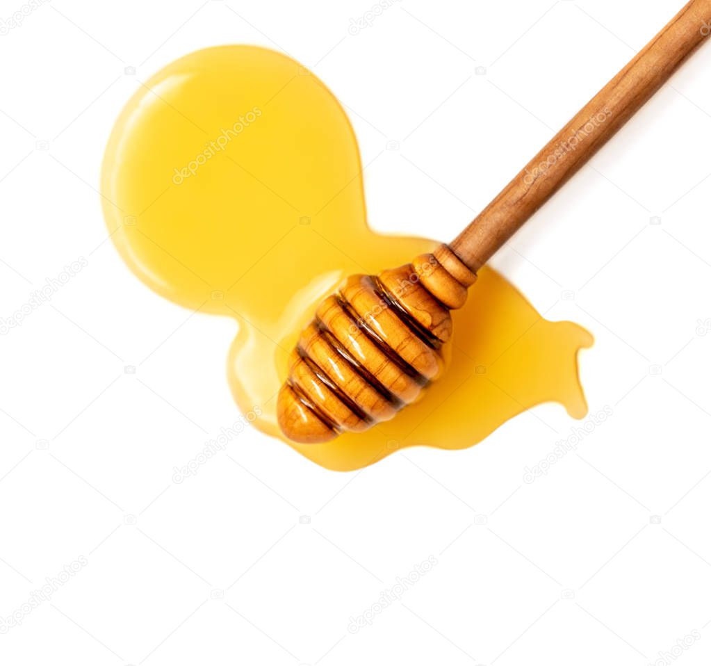 Honey dripping isolated on a white background. Natural bee Honey flowing drops, macro