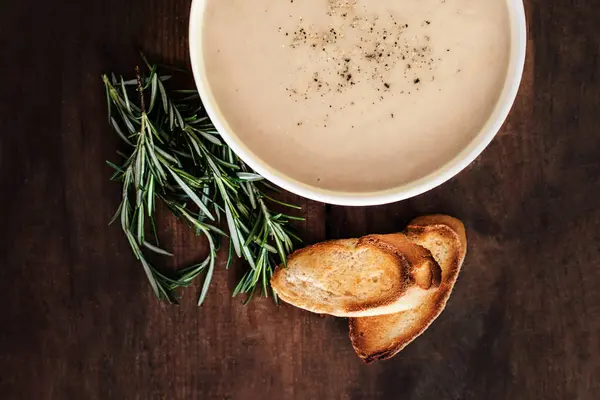 Creamy Mushroom Soup in a white bowl on rustic wooden table. . Top view. Copy spac — Stock Image Creamy Mushroom Soup White Bowl Rustic Wooden Table Top View Royalty Free Stock Photos