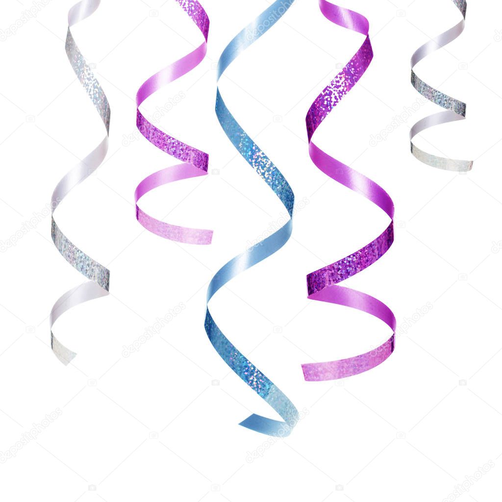 Party background with serpentine or streamers hanging on white background.   Celebration, festive concept