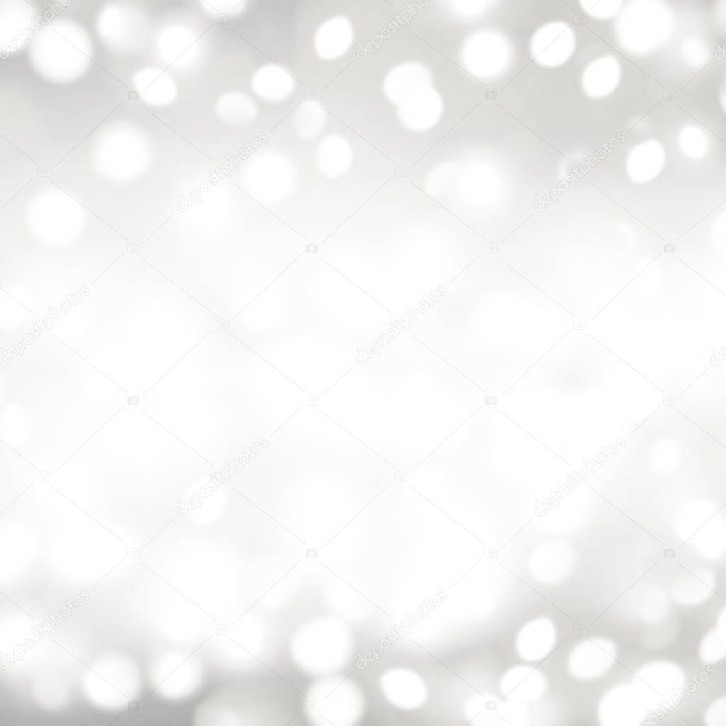 Abstract background with silver and white bokeh lights