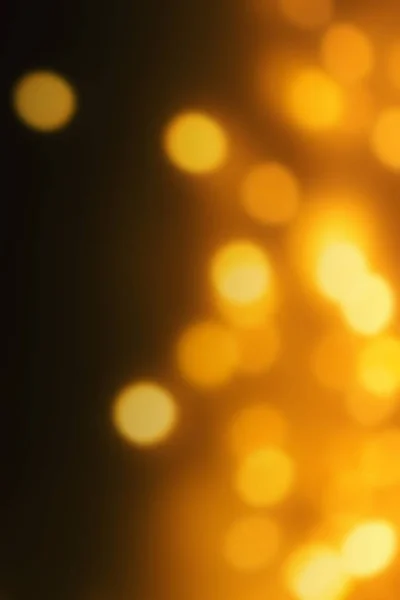 Golden Christmas Bokeh Lights Dark Background Abstract Yellow Glowing Defocused — Stock Photo, Image