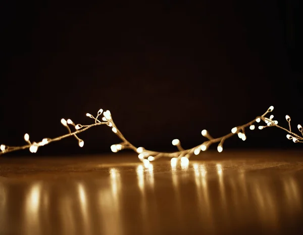 Christmas Golden Lights Black Background Xmas Garland Wooden Floor Copyspace — Stock Photo, Image