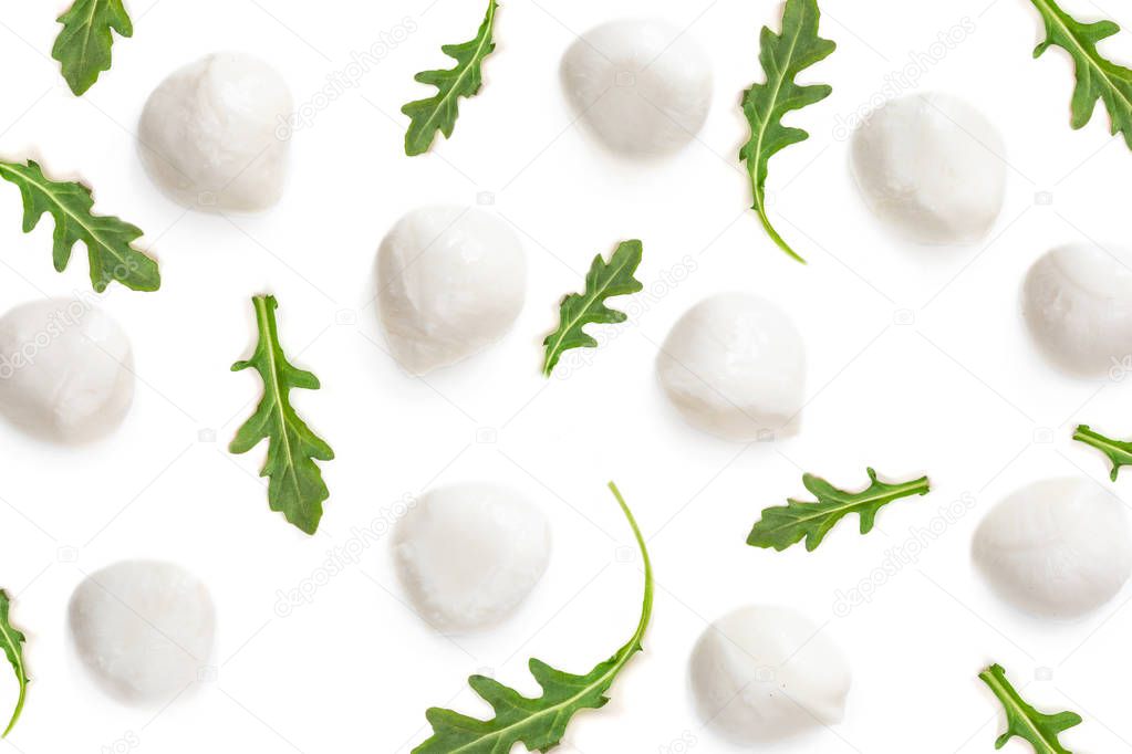 Mozarella with Arugula isolated on white Background. Pattern. Creative layout made of Mozarelle Cheese Balls close up. Top view. Flat lay