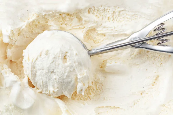Arka Plan Olarak Kapsayıcısında Bir Kepçe Ile Vanilyalı Dondurma Makro — Stok fotoğraf