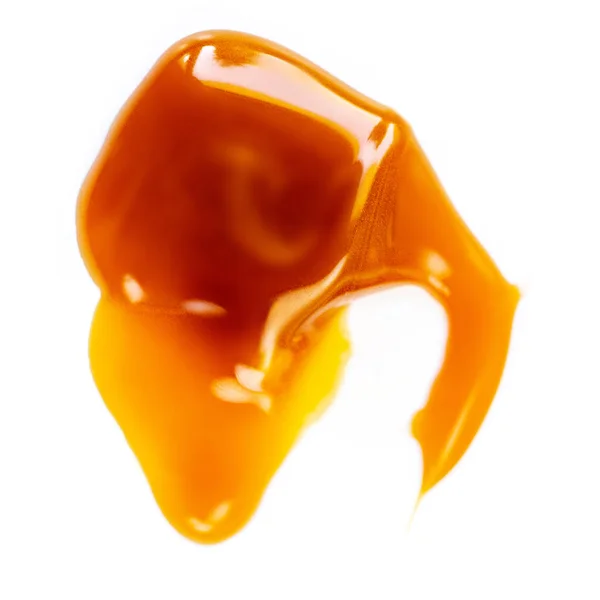 Kolasås Droppe Isolerad Vit Bakgrund Gyllene Kola Toffee Kola Flytande — Stockfoto