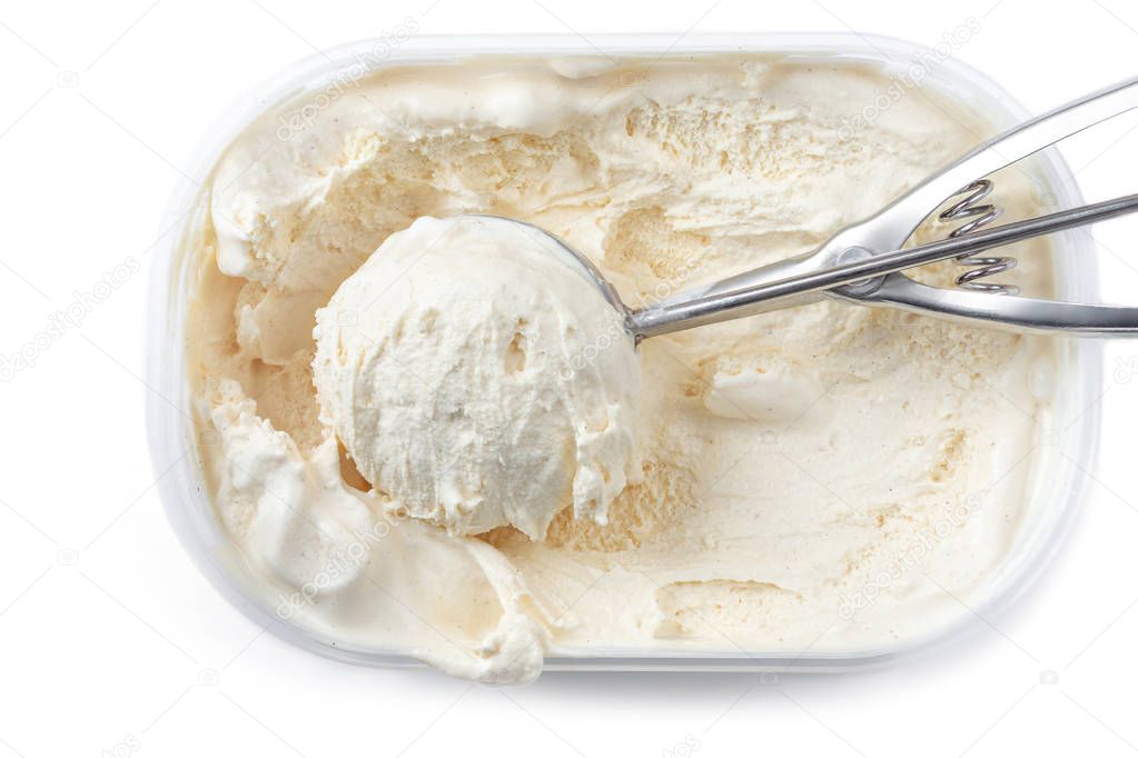 Vanilla ice cream with a scoop in  container isolated on white background. Scooped out ice-cream,  top view.
