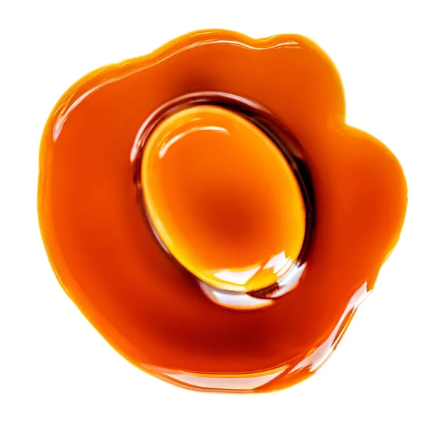 Caramel candie with flowing caramel sauce isolated on a white ba — Stock Photo, Image