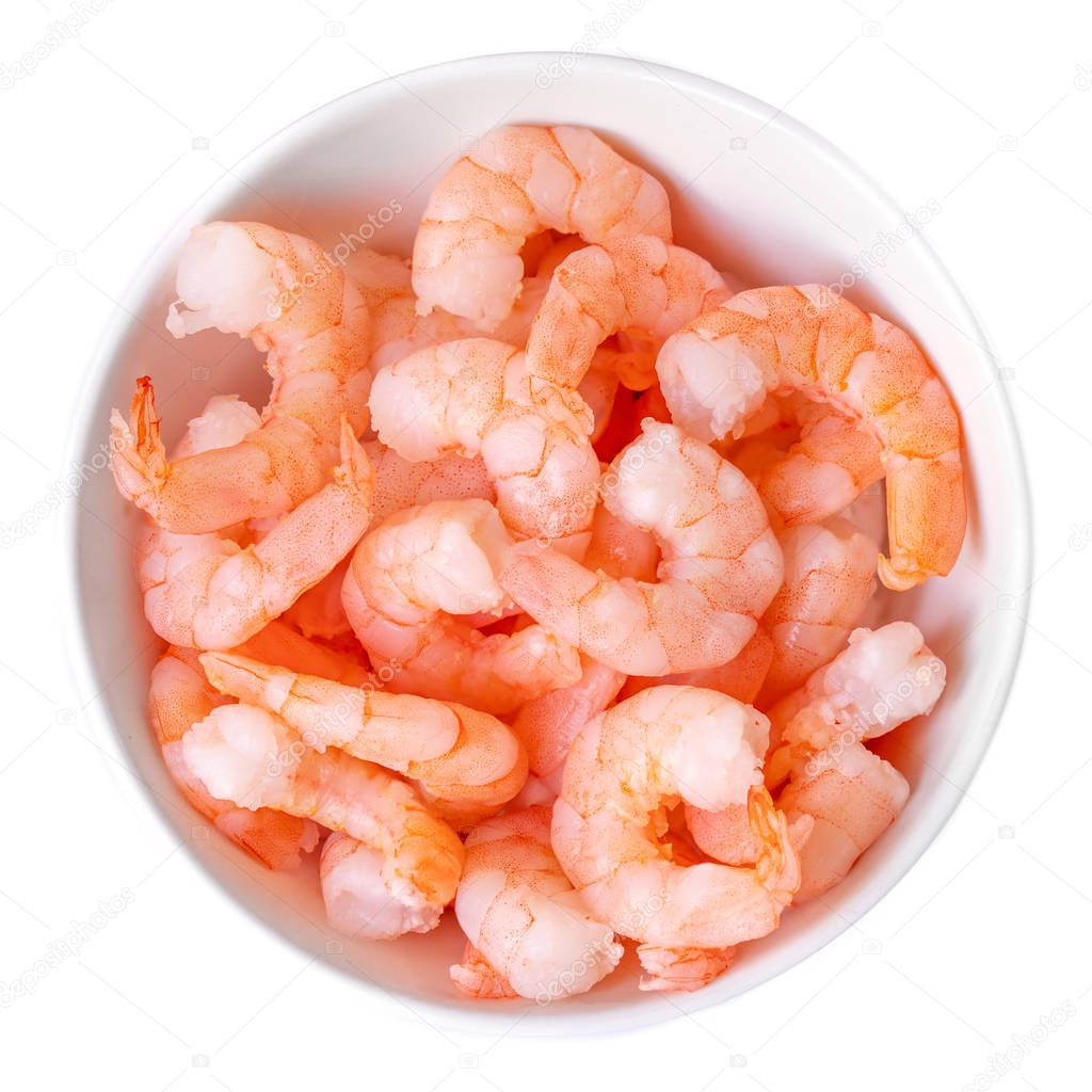 Peeled shrimps in a bowl isolated on white background. Top vie