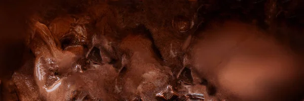 Chocolate chocolate helado textura marrón fondo. Delicioso re — Foto de Stock