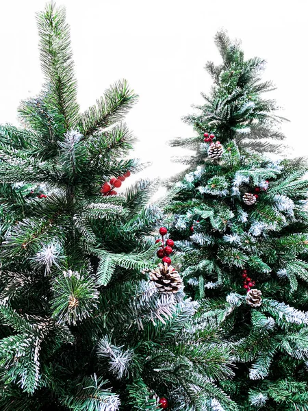 Minimalistic Christmas tree decorated with pine cones and red be — Stock Photo, Image