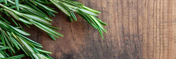 Rosemary herb on a wooden background, copyspace. Fresh rosemary — Stock Photo, Image