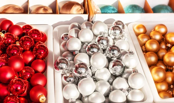 Christmas balls in boxes on a Christmas market. Close up. Tradit — Stock Photo, Image