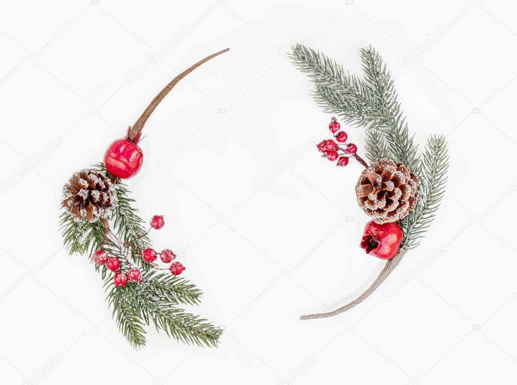 Christmas tree branches with decorations isolated on a white bac