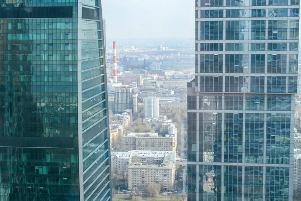 Bird\'s-eye view of the city between two modern glass skyscrapers. Moscow, Russia