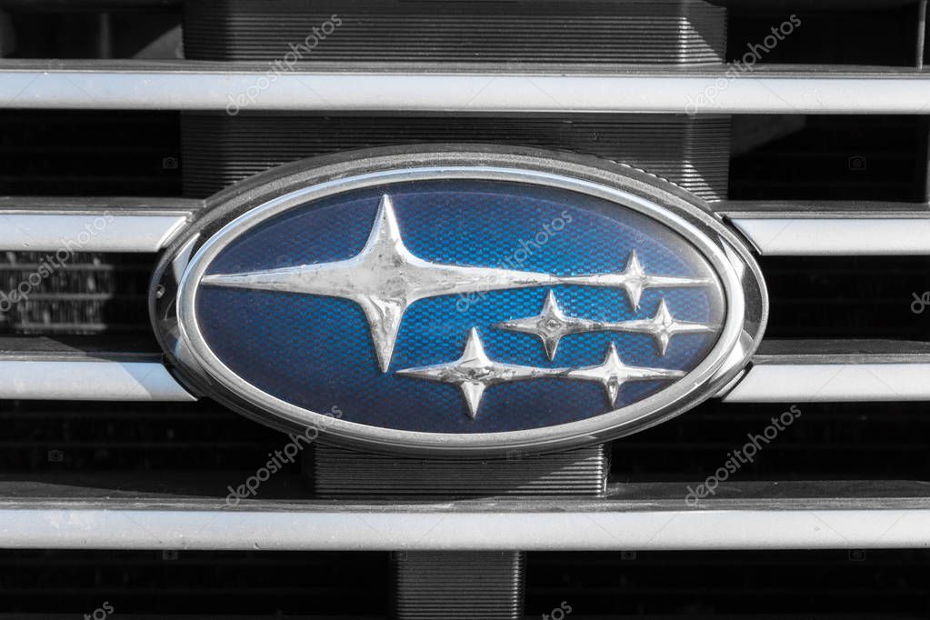 KYIV, UKRAINE - SEPTEMBER 08, 2019: Subaru emblem on a radiator grill. Silver stars on a blue background