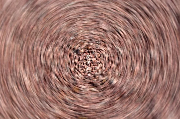 Verschwommene radiale Bewegung feiner kieferroter Hintergrund. Kreisförmige Textur — Stockfoto