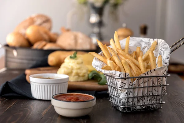 Food composition of french fries dish with sauces