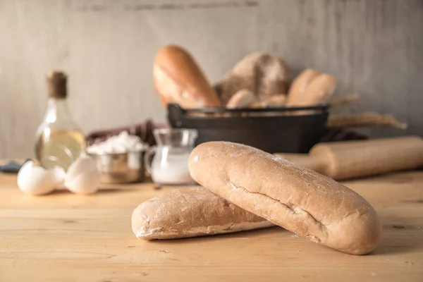 Making bread. Rustic style, Different kinds of bread rolls on table.