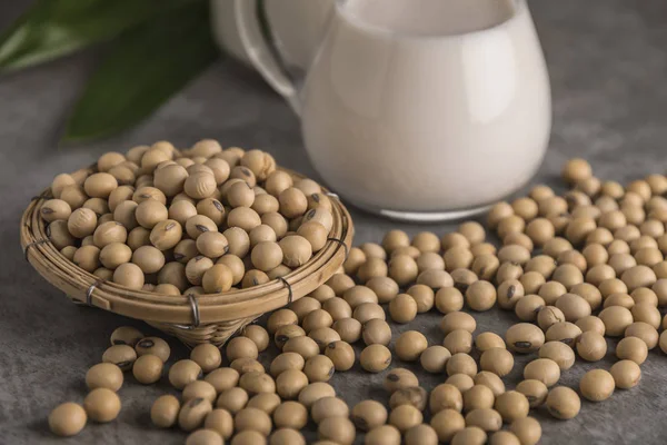 Soybeans and milk in soft focus background