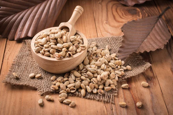 Soybeans with soybean oil on wooden background