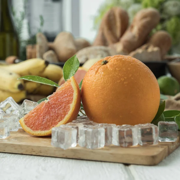 Oranges Bananas Ice Cubes Wooden Board — Stock Photo, Image