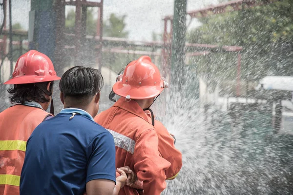 Rear View Firefighters Rehearsing Fire Fighting Plans Lpg Storage Facilities — Stock Photo, Image