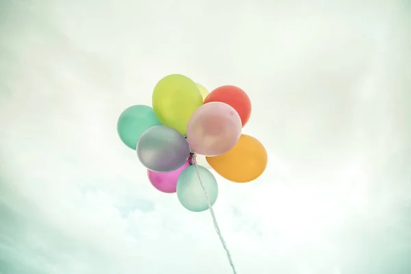 Colorful balloons with retro filter effect.