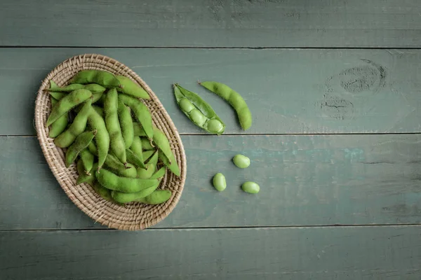 Green Japanese Soybean in wooden bowl on table wood — Stock Photo, Image